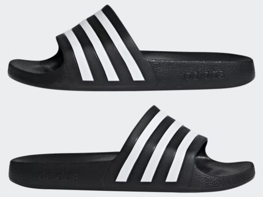 pair of black and white adidas aqualette slides