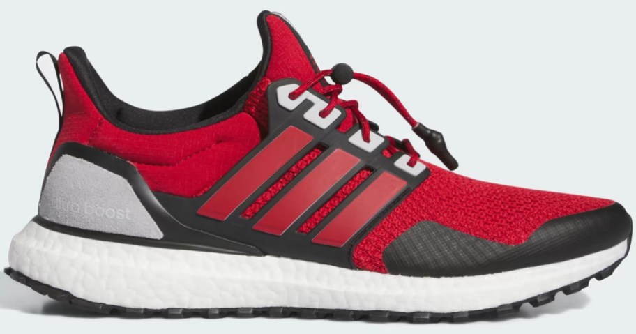 red and black adidas ultraboost shoes stock image