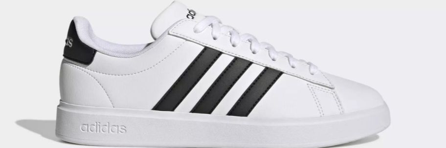 white adidas sneaker with black stripes
