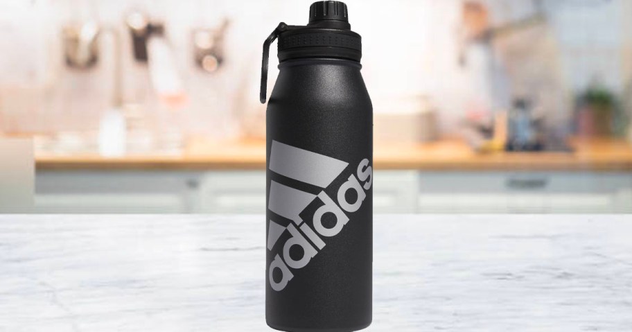 black adidas water bottle sitting on countertop