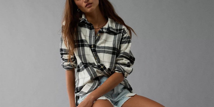 woman wearing white and black flannel shirt