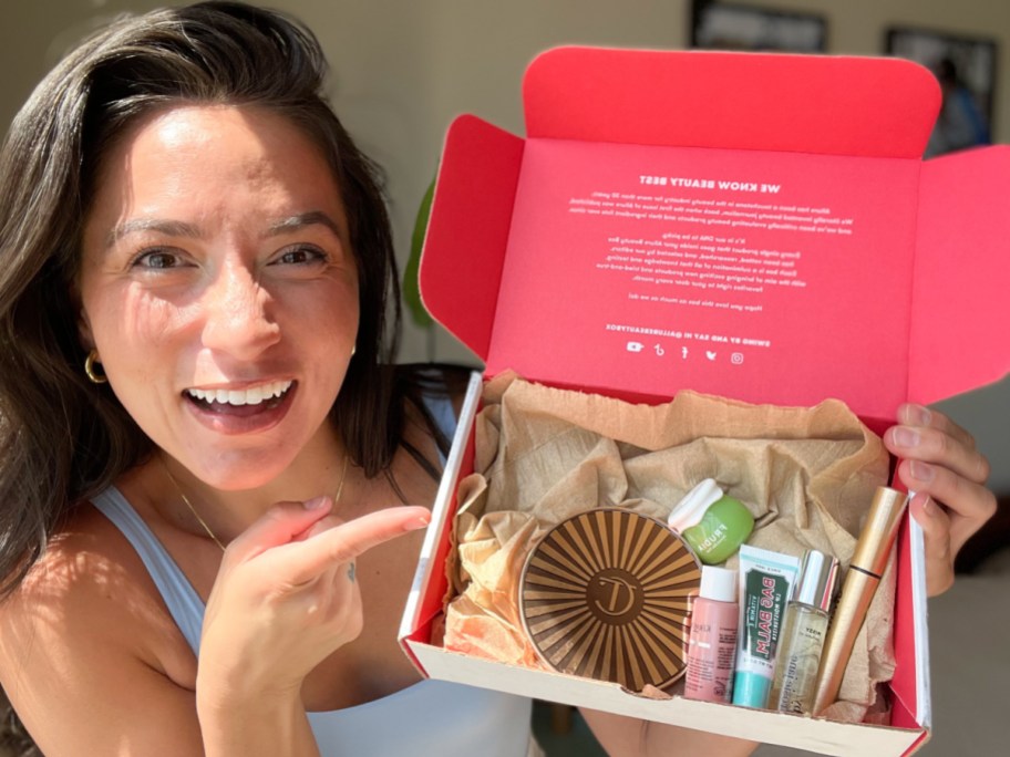 women pointing at beauty box