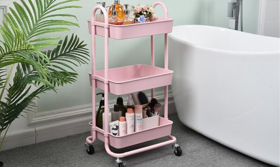 pink metal utility cart near bathtub 