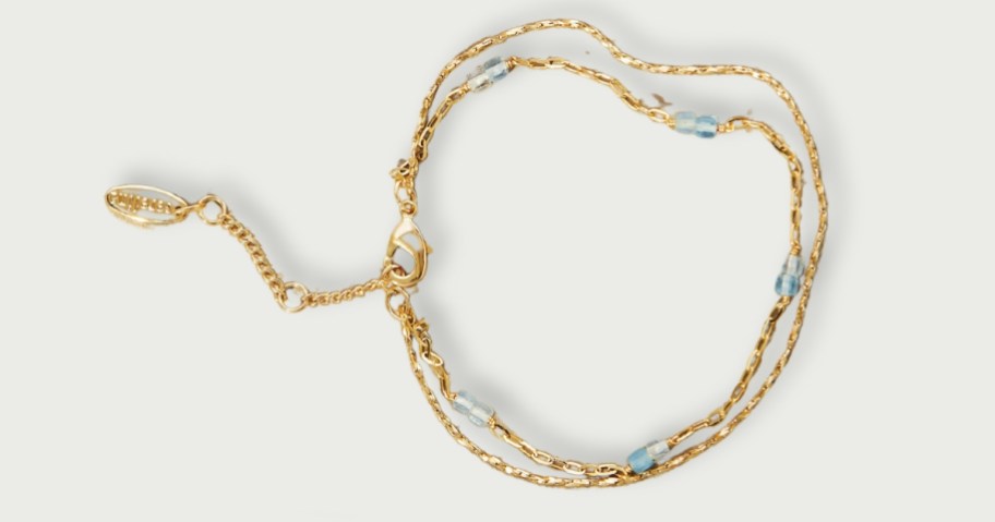 gold double layer bracelet with clear and grey stones