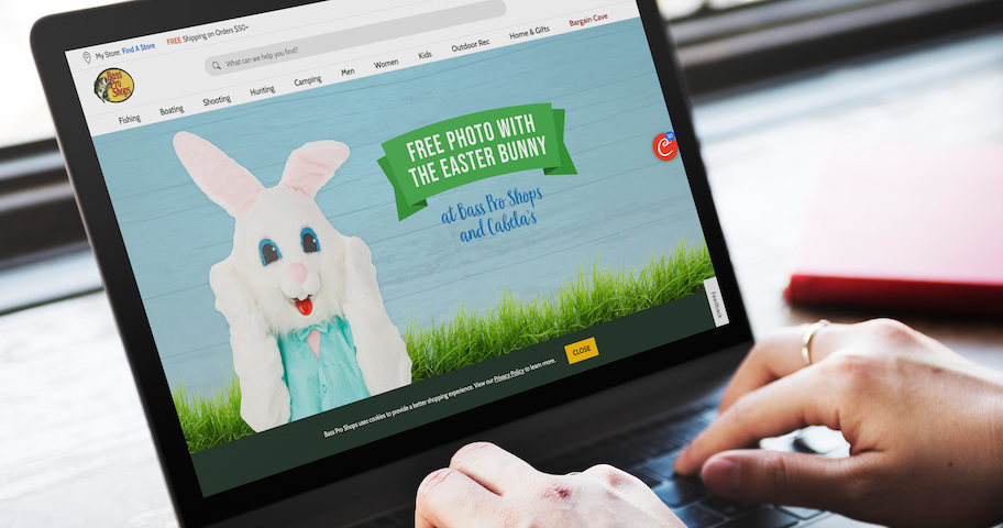 hands typing on laptop with easter bunny free photo at bass pro shops promo