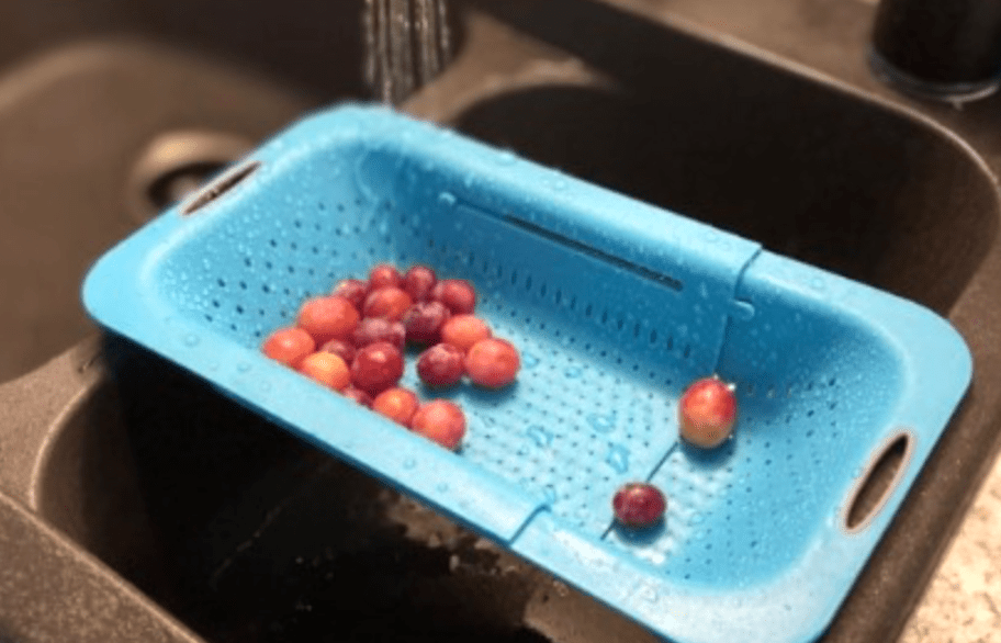 blue colander in sink