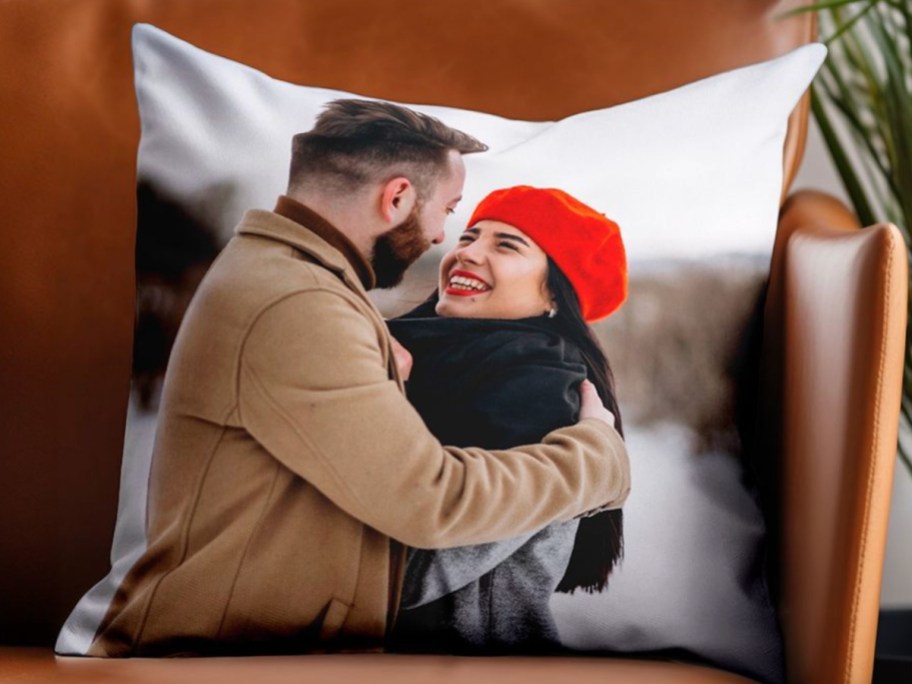 couple on white photo pillow on leather chair