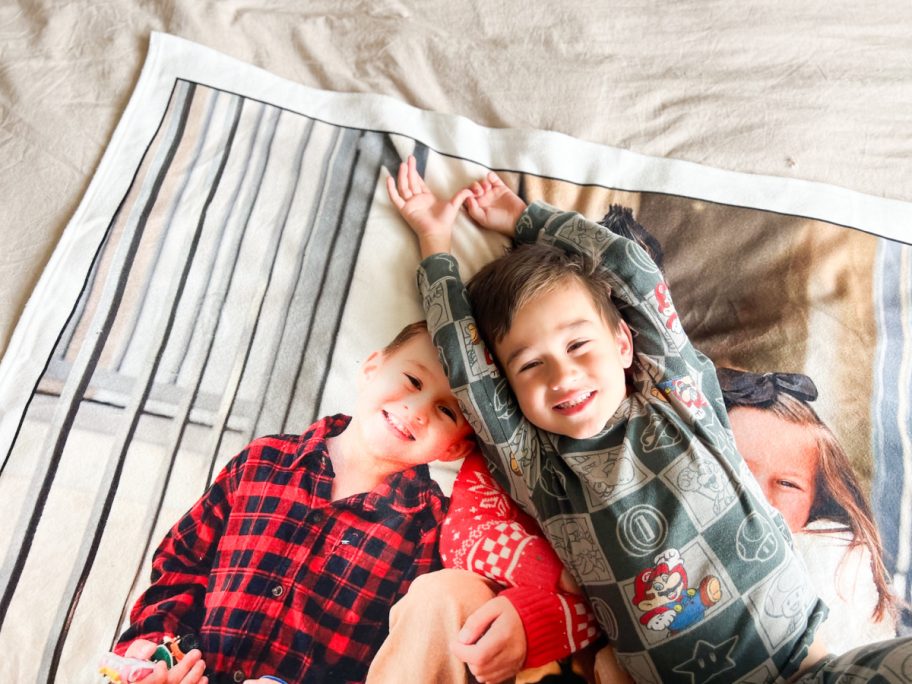 little boy laying on photo blanket