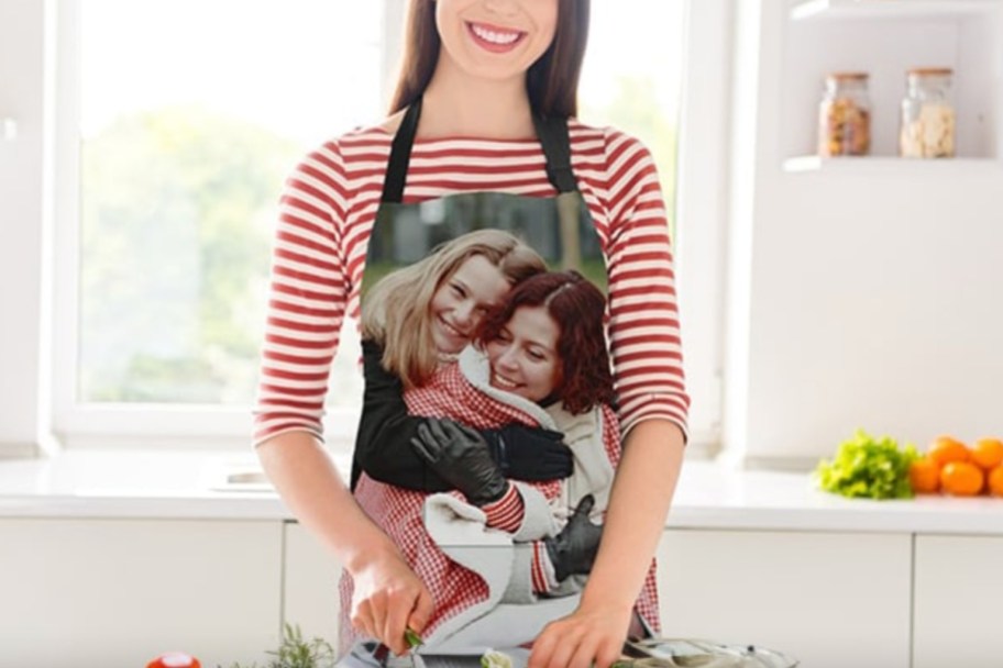 woman in kitchen wearing photo apron