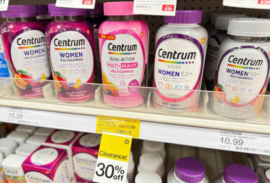 bottles of centrum vitamins on a store shelf