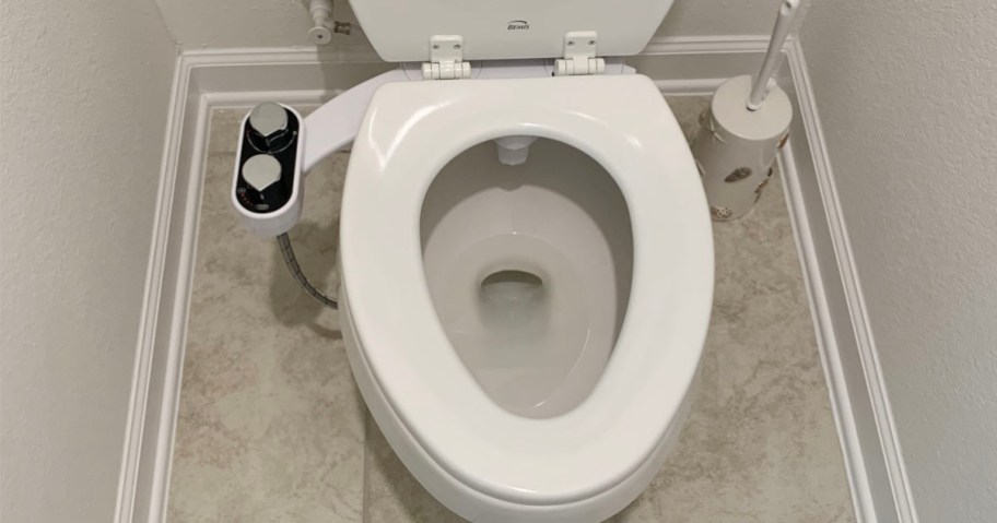 white bidet attached to toilet