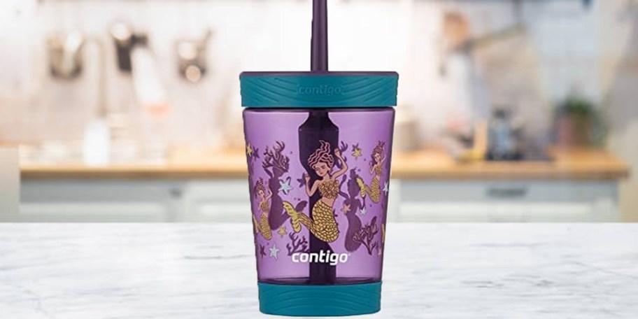 teal and purple mermaid tumbler on countertop