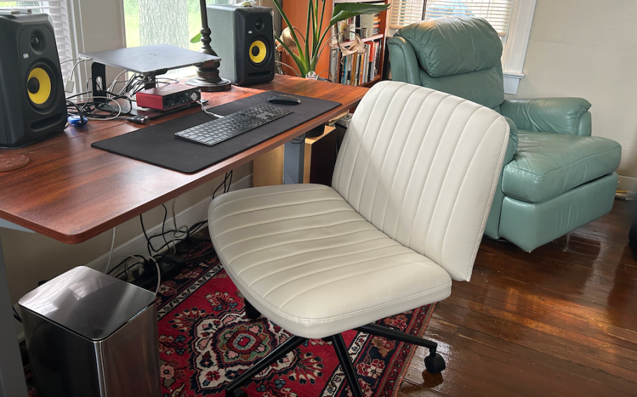 armless white office chair at computer desk
