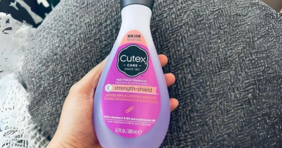 Cutex nail polish remover in hand