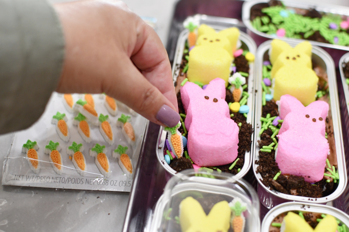 decorating mini easter cakes with peeps and sprinkles