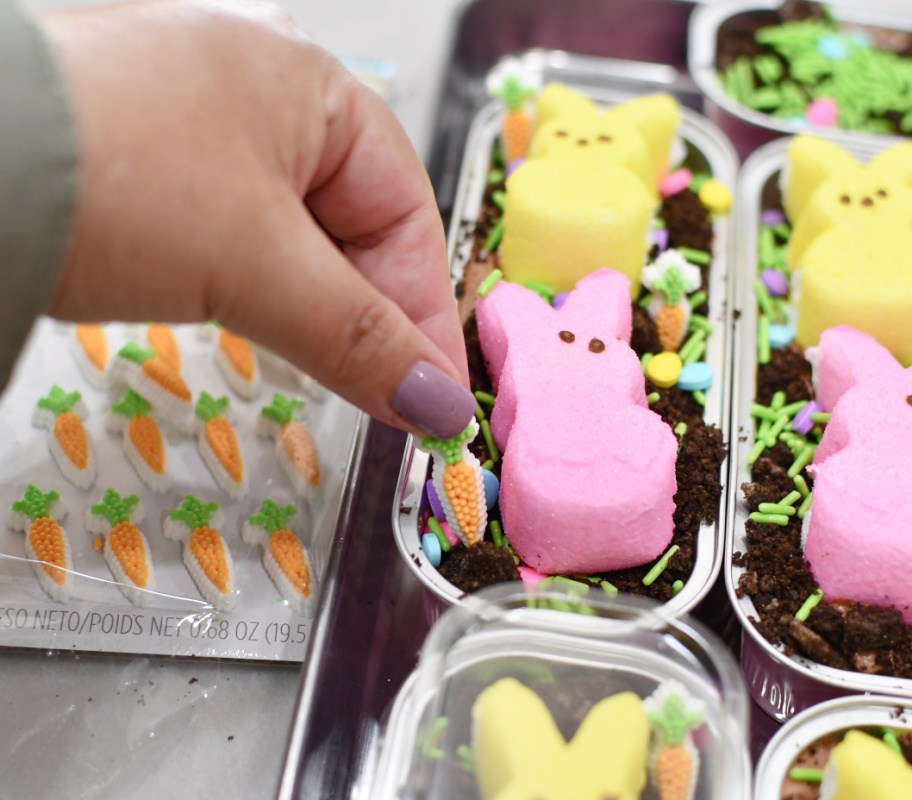 decorating mini easter cakes with peeps and sprinkles
