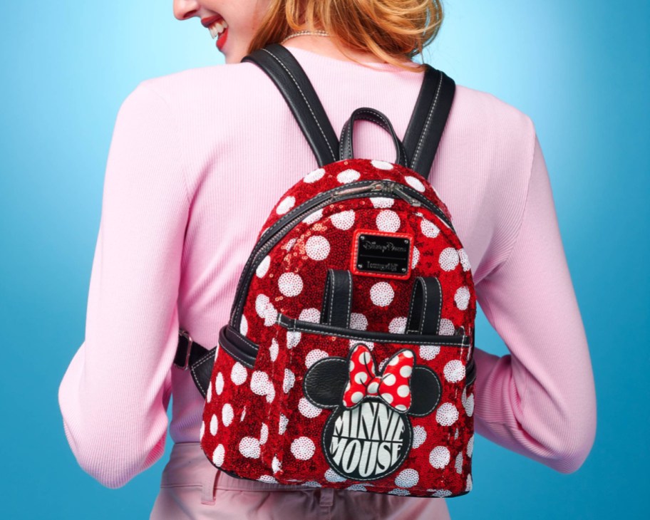 woman wearing red dot sequin minnie backpack