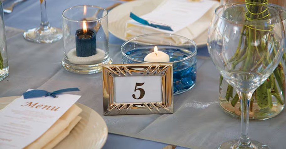 close up of framed table number on wedding table