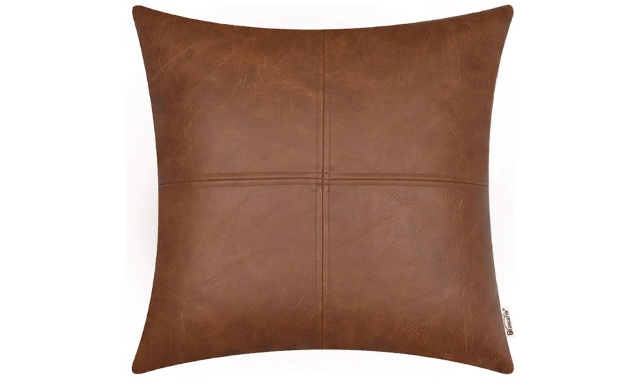 Brown fake leather pillow stock photo