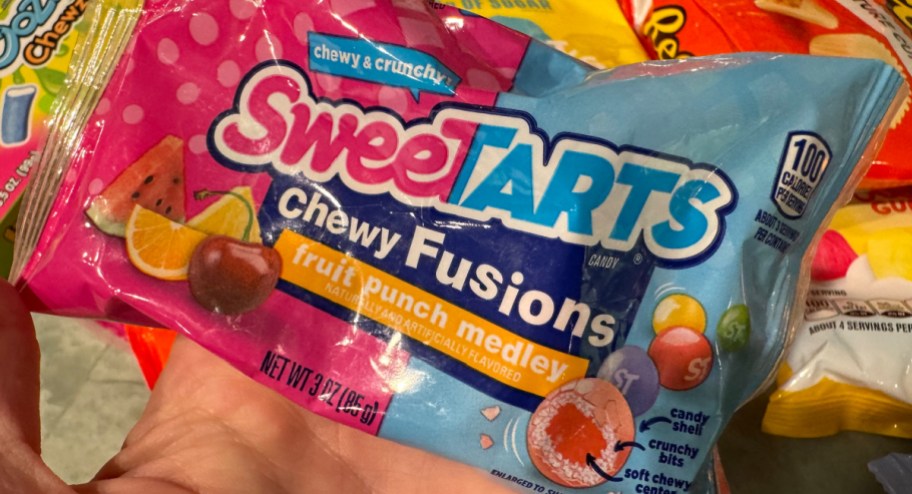 hand holding Sweet tarts candy bag