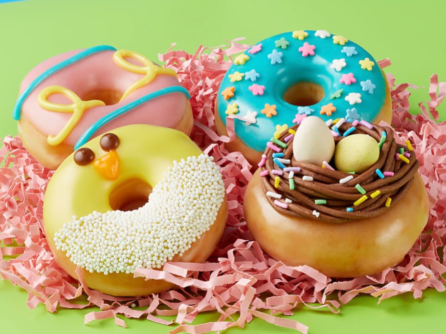 4 spring mini doughnuts decorated like a chick, nest, teal with sprinkles and pink glazed