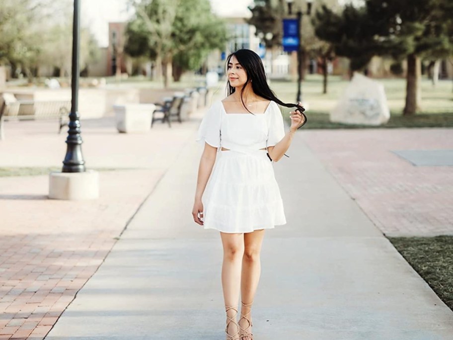 woman wearing a white dress outside