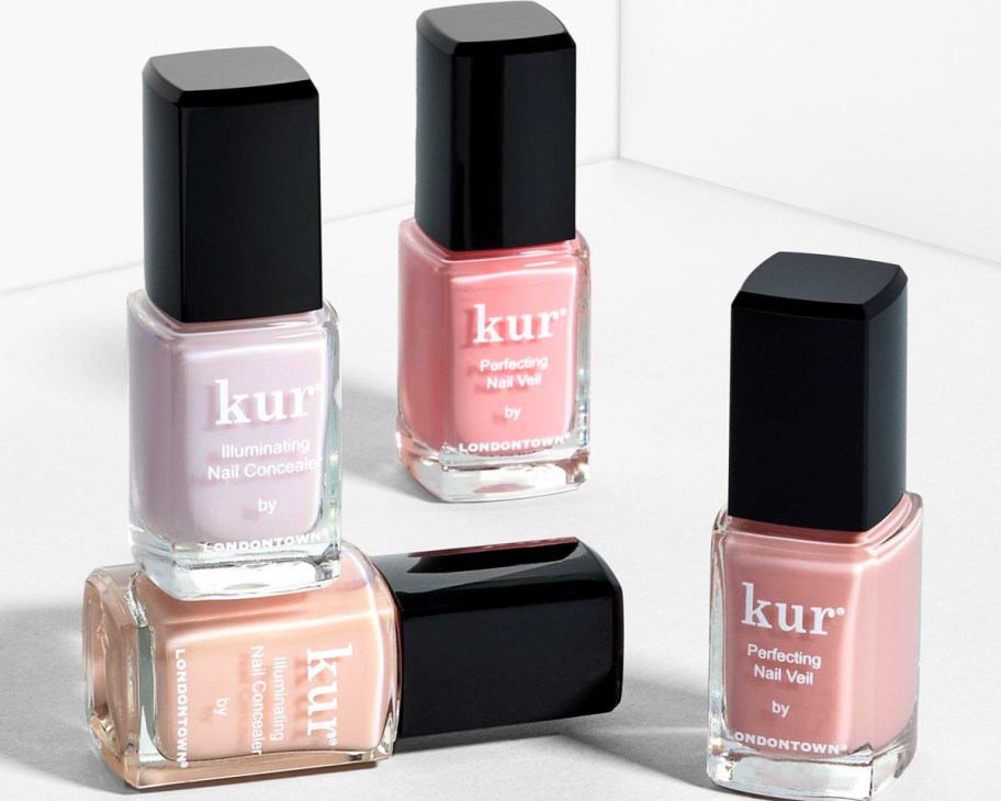 four kur nail concealers in lavender pink and tan
