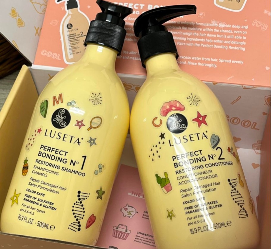 two pale yellow pump shampoo bottles in box