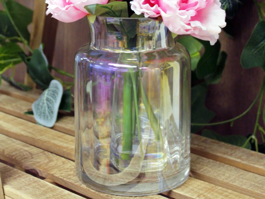 pink flowers in an iridescent glass vase