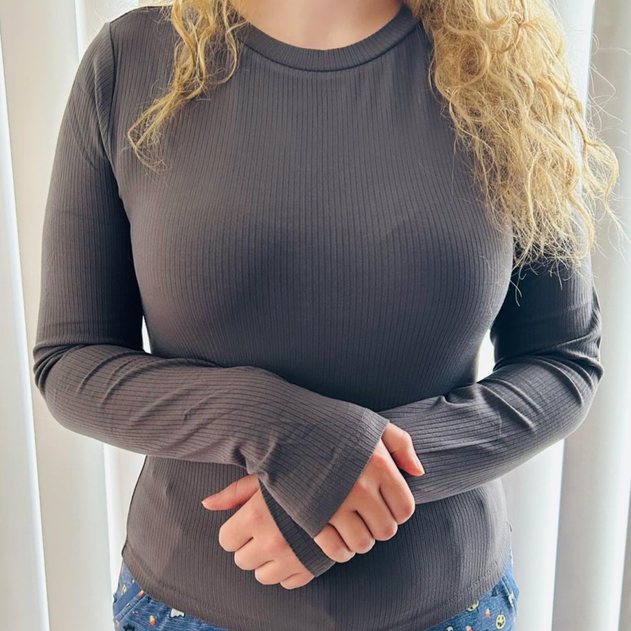 woman wearing a dark long sleeve shirt