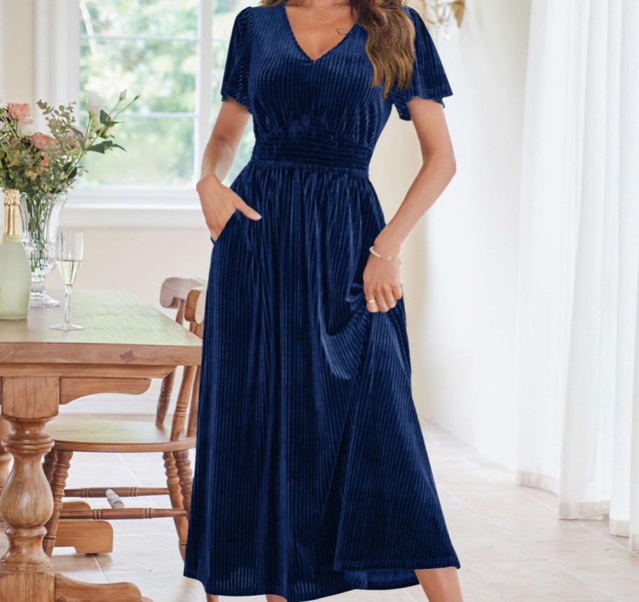 woman wearing blue V-neck dress