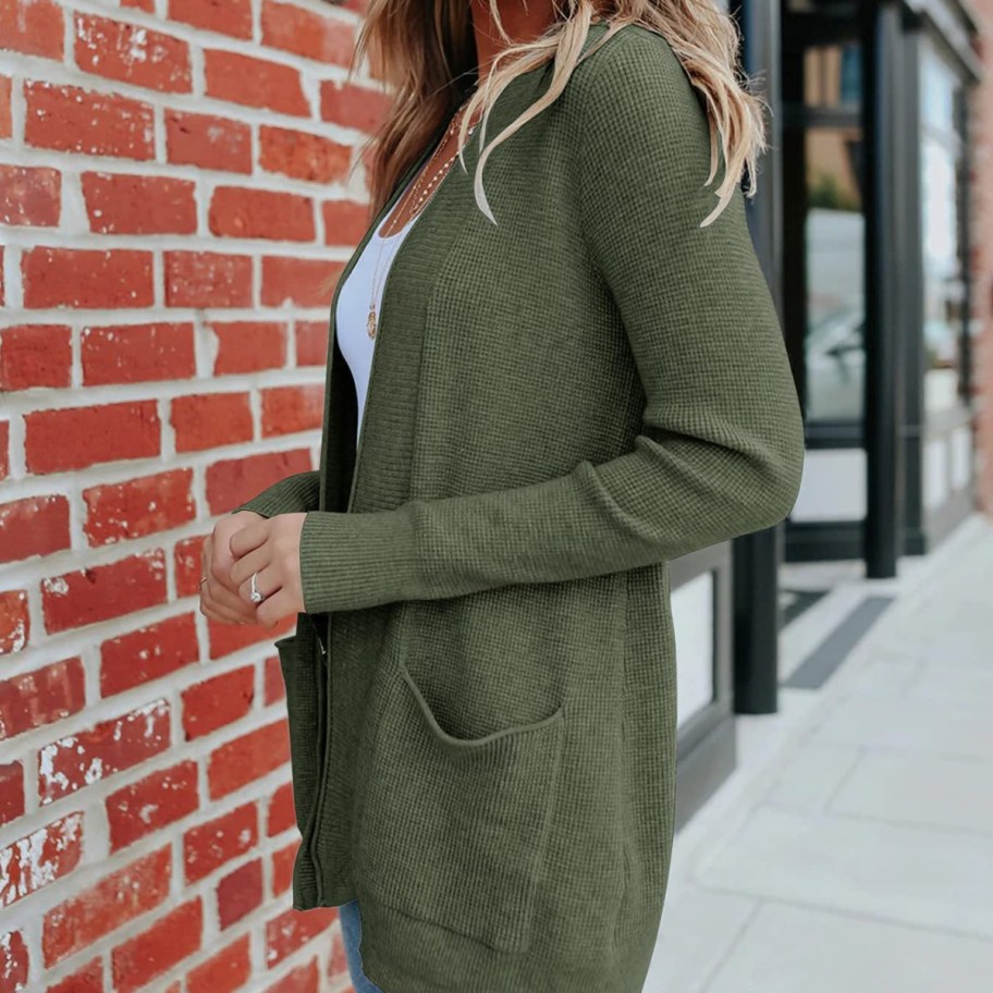 woman wearing green cardigan outside