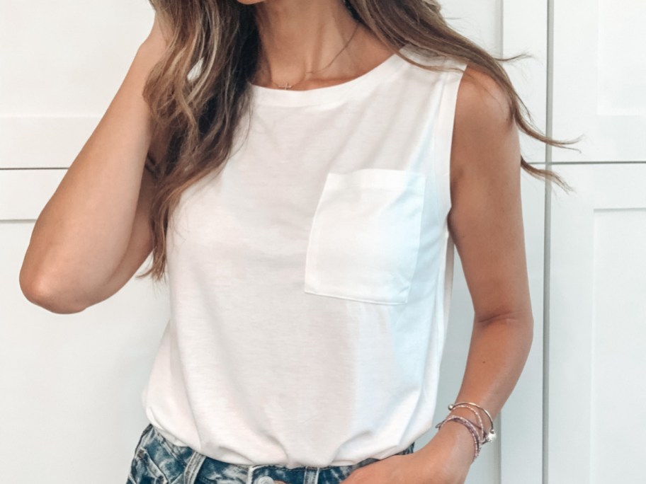 woman wearing white sleeveless shirt
