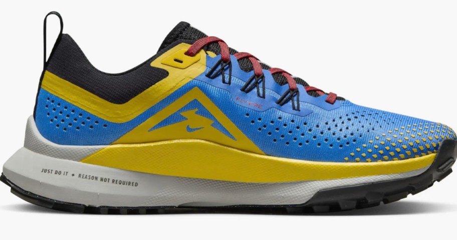 stock image of nike blue and yellow running shoe