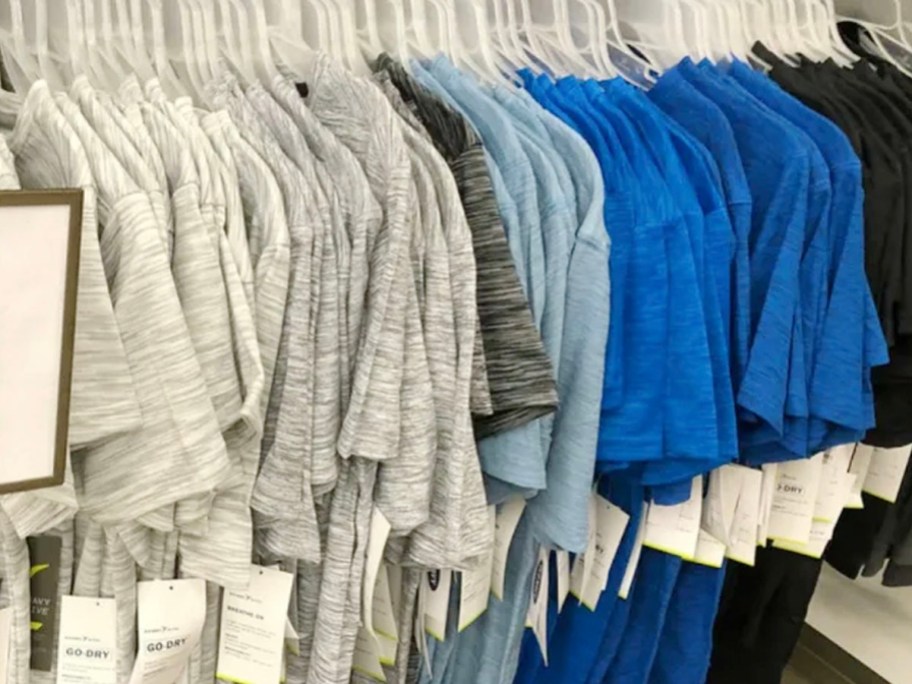 gray and blue go dry tees hanging in store