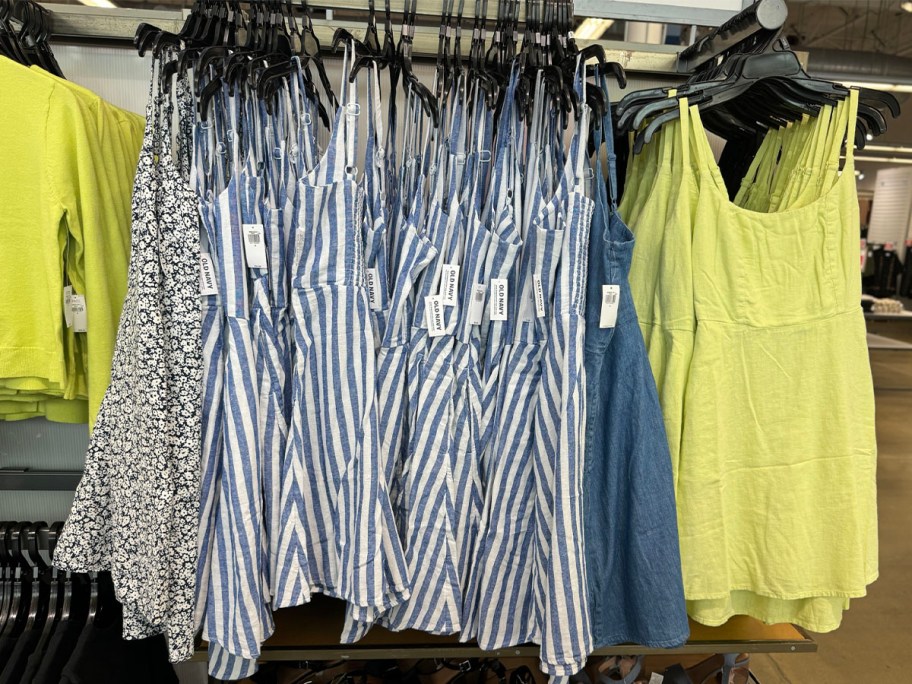 blue and white striped and lime green womens dresses hanging in old navy store