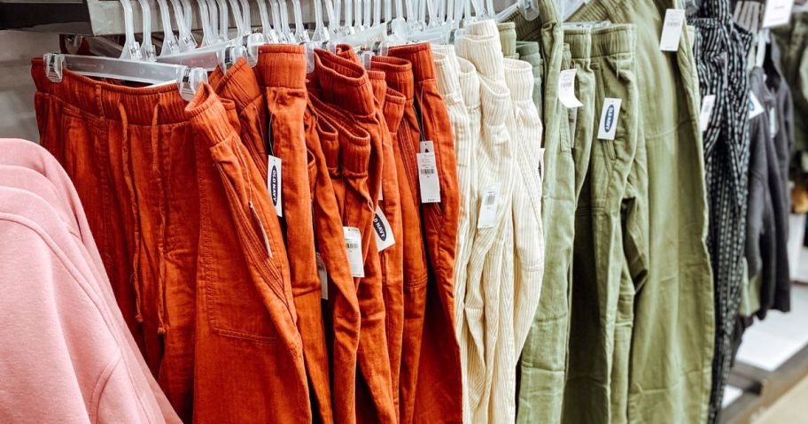 old navy pants hanging on rack in store