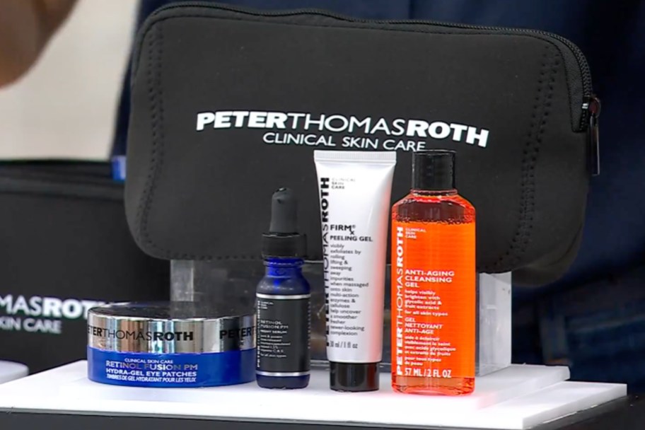 peter thomas roth 4 piece skincare set in front of makeup bag