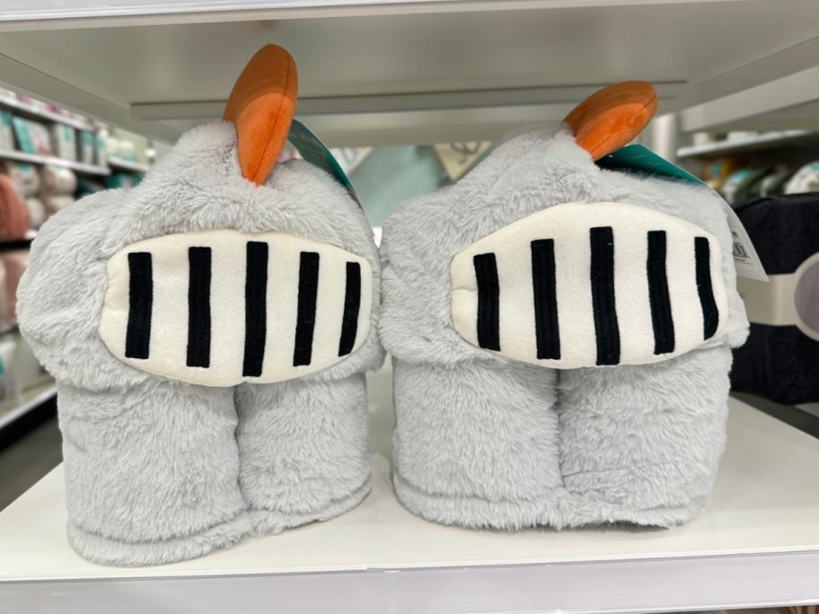 two knight hooded blankets sitting on shelf in target store