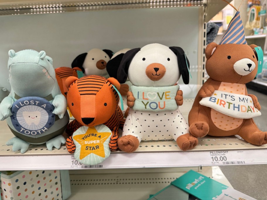 pillowfort plus toys sitting on shelf in target store