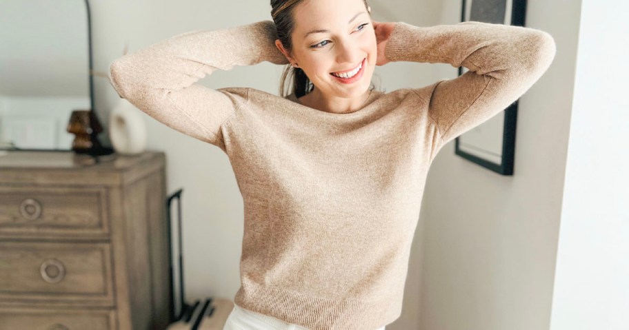 woman wearing tan cashmere sweater