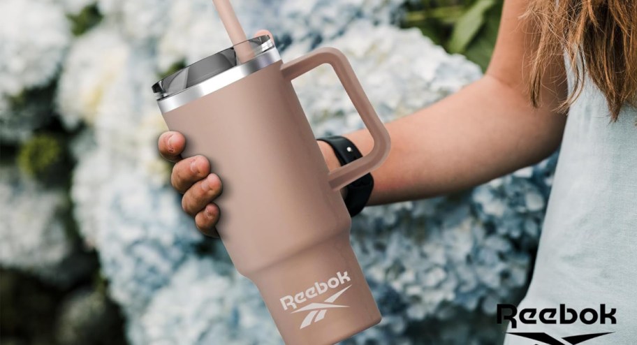 reebok tumbler in woman's hand