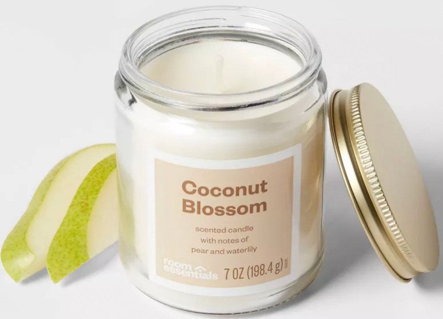 white room essentials coconut blossom jar candle next to pear with lid next to it