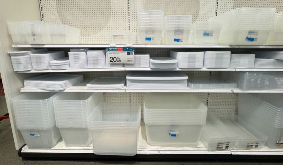 room essentials plastic storage bins with lids stacked on a store shelf