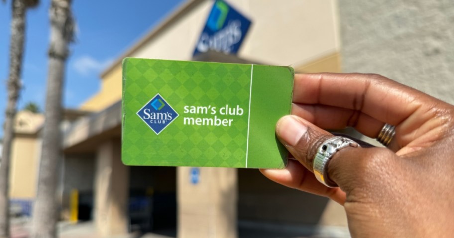 sam's club membership card in hand in front of store