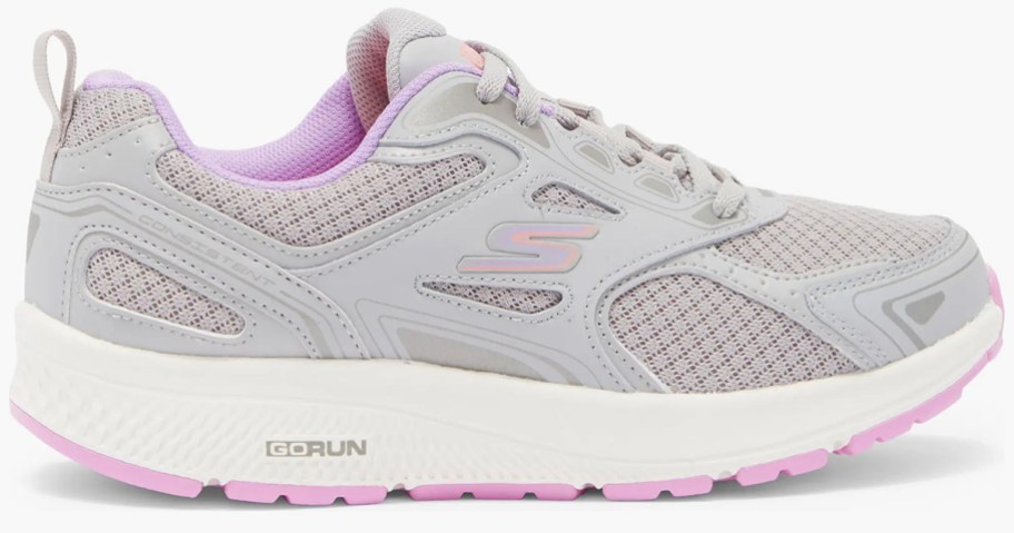 gray and light purple sketchers shoe stock image