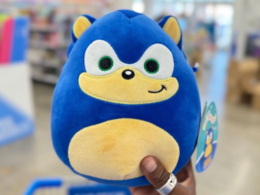 a woman hand holding a sonic the hedgehog 6m5 inch squishmallow