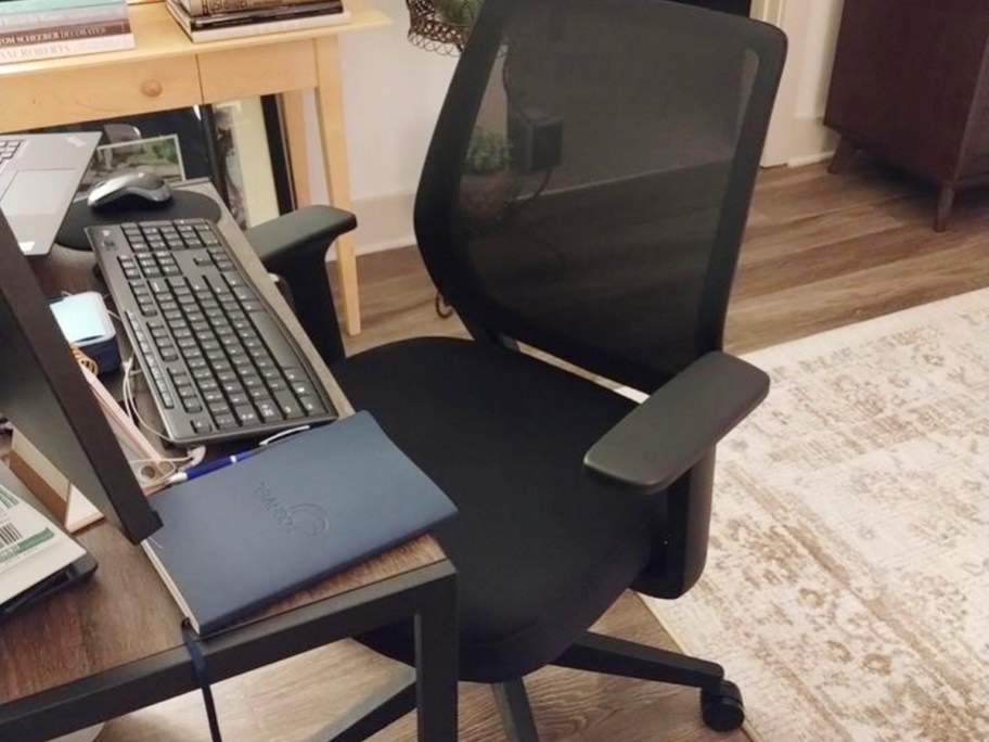 black mesh office chair at desk