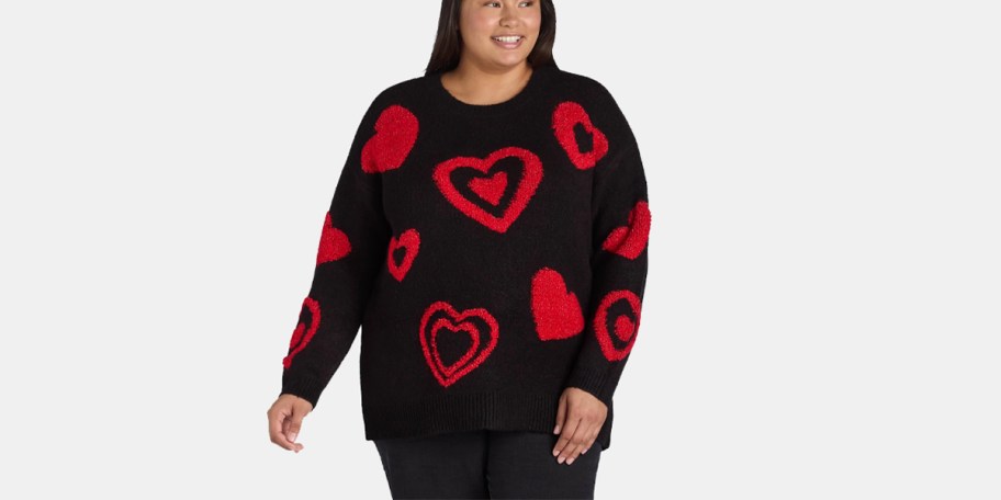 woman wearing black sweater with red hearts 