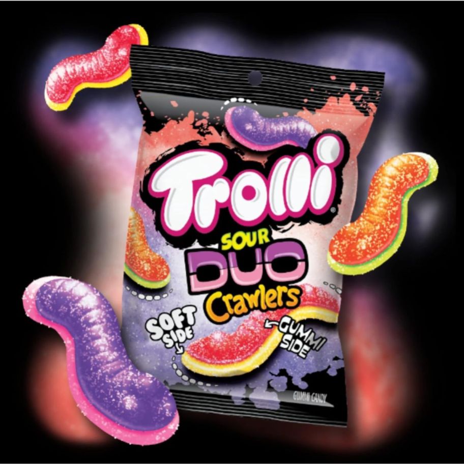 a bag of trolli sour duos crawlers on a black background